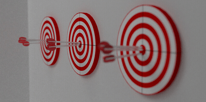 picture of 3 red and white circular targets with red arrows in the center